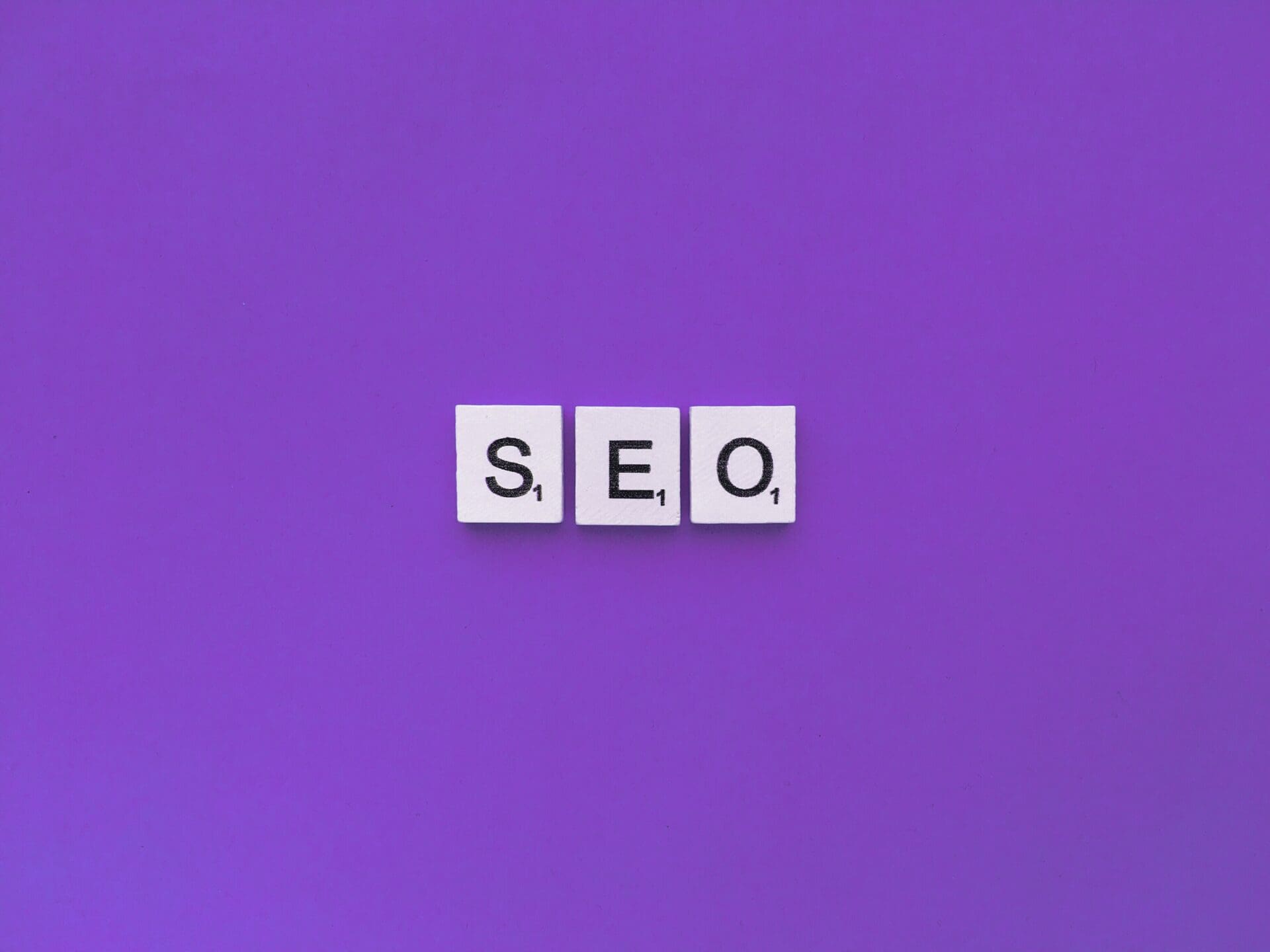 seo scrabble letters word on a violet background 2022 11 11 21 24 25 utc